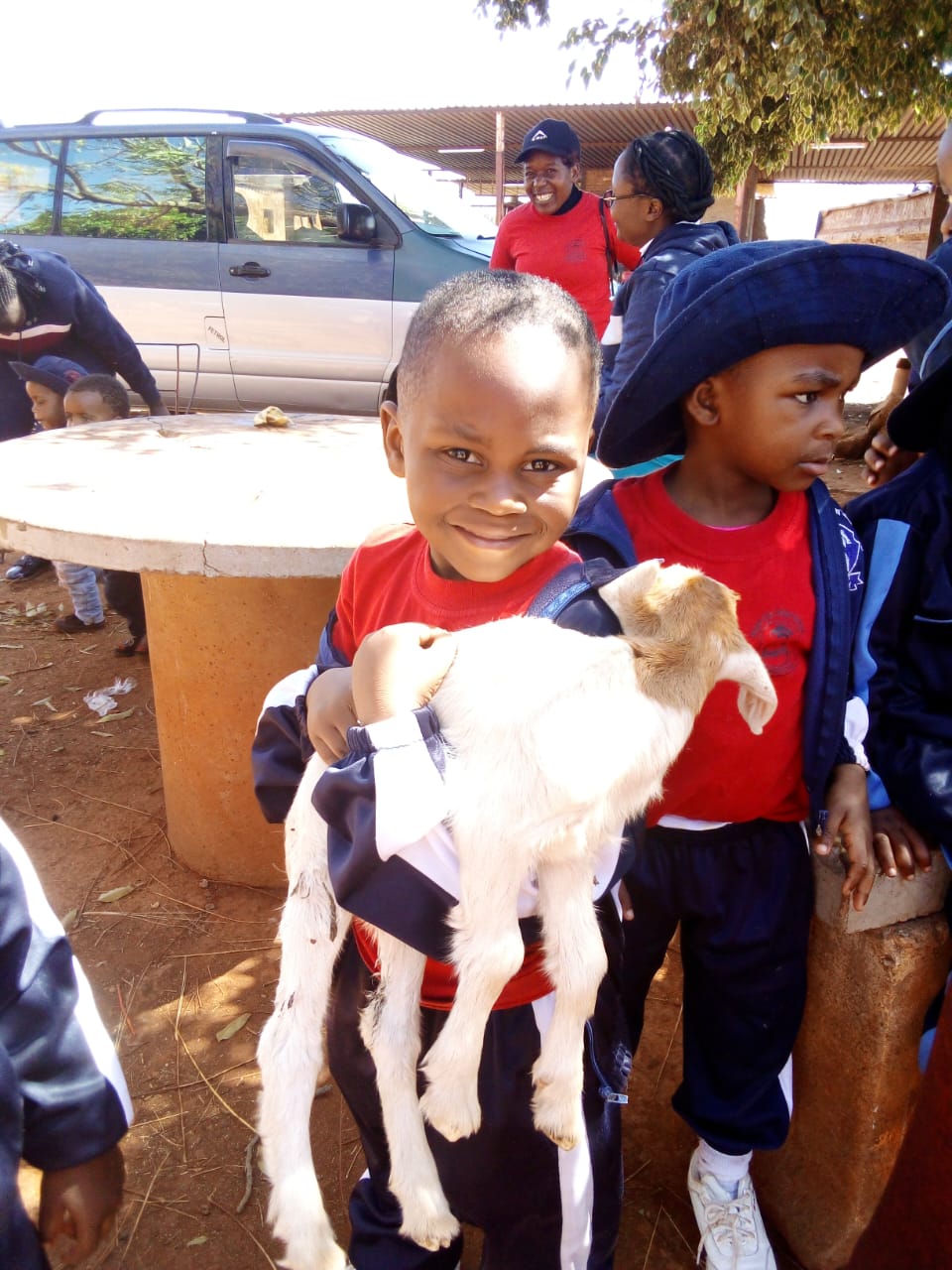 A young learner smiling at Multi Academy